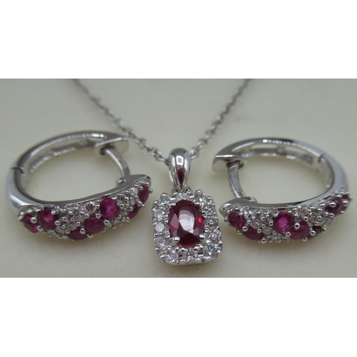 42 - 9ct white gold ruby and diamond hoop earrings inset with seven rubies and ten round cut diamonds and... 
