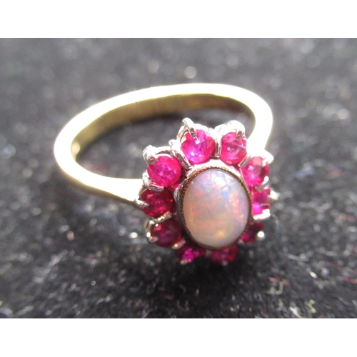 62 - 18ct yellow gold opal and ruby cluster ring, stamped 750, size P 1/2, 4g