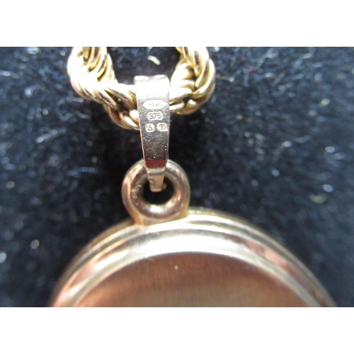 65 - 9ct yellow gold bright cut locket, clasp stamped 9K, 7.2g