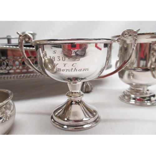 93 - Silver plated salver with raised pierced gallery on bird claw feet with a selection of various silve... 