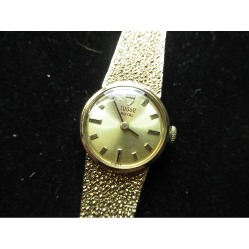 1121 - Ladies Tudor Royal 9ct gold cased wristwatch on matching integral bark effect bracelet, clasp end li... 