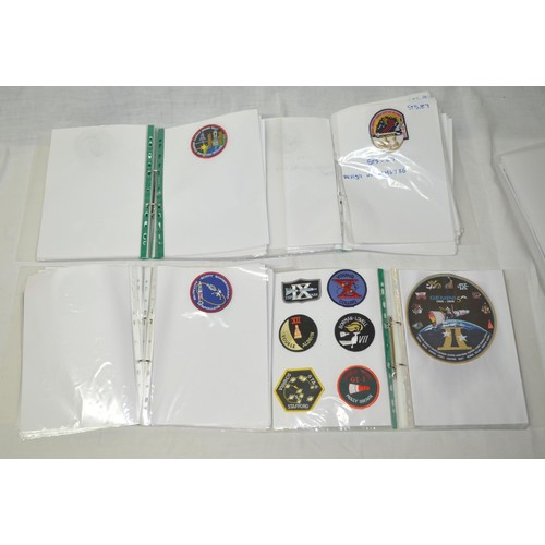 41 - A4 presentation albums including a large number of NASA mission patches from the Apollo programme.