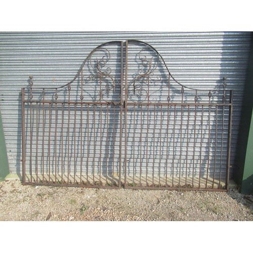 1601 - Large pair of arched cast and wrought iron driveway gates, with leaf and pierced decoration, W305cm ... 