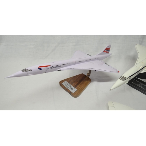 16 - Four 1/100 Concorde models, 3 with stands. These are hand crafted kiln dried wood models from Gtrans... 
