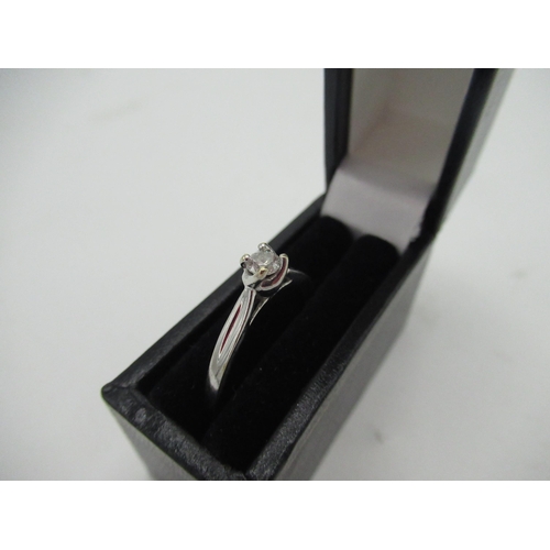 9 - Hallmarked 9ct white gold diamond solitaire ring with a round cut diamond, claw set in twisted claw ... 