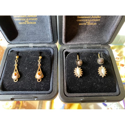 21 - Pair of opal and CZ stud earrings, pair of black pearl screw back stud earrings, and a pair of drop ... 