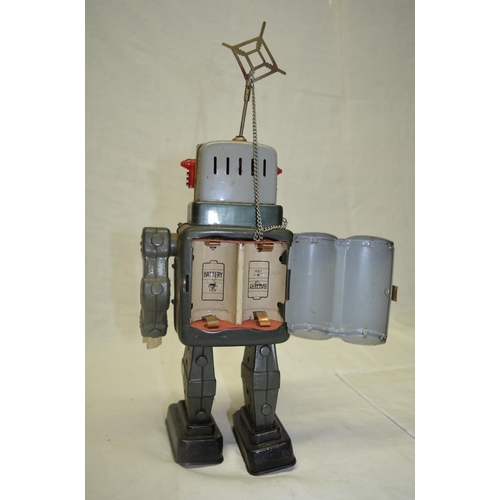 61 - Vintage tin plate walking battery operated robot, works intermittently.