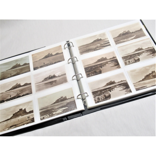 799 - Folder containing approximately two hundred postcards of Bamburgh Castle