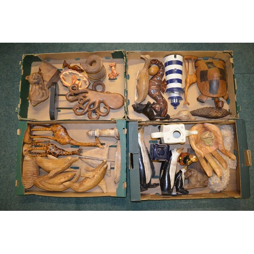 72 - Four boxes of hand carved ornaments, mostly wooden, including a giraffe, dolphin, octopus etc., a Ri... 