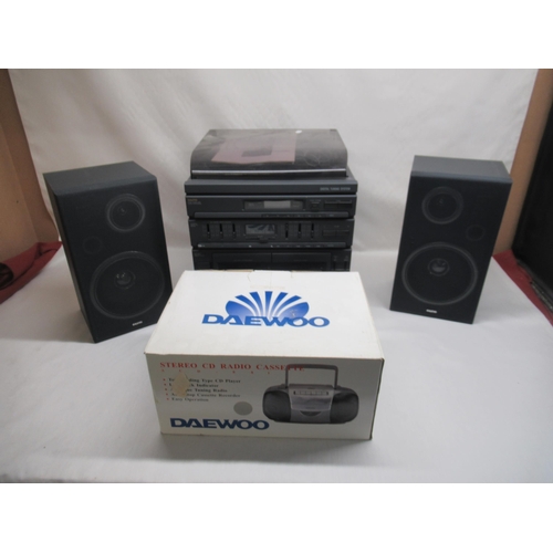 809 - Sanyo DC-X502 DC stereo system with two speakers and a Daewoo stereo CD radio cassette portable play... 