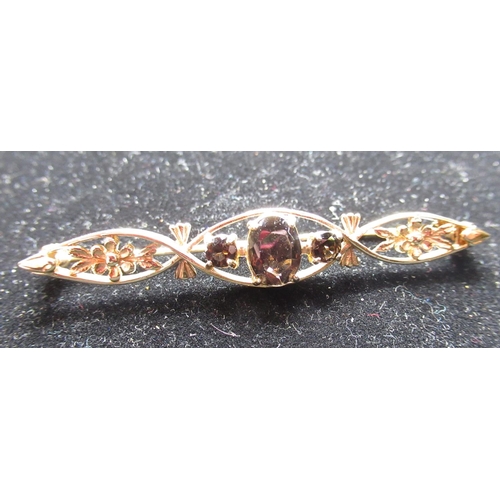 14 - Hallmarked 9ct yellow gold bar brooch with three oval faceted smokey quartz stones inset in an openw... 