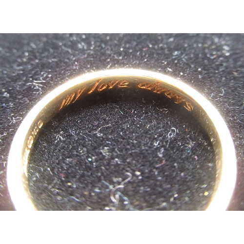 23 - Hallmarked 18ct yellow gold wedding band with inscription 