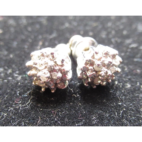42 - Pair of 9ct white gold diamond cluster earrings with round cut, claw set diamonds, 1.4g