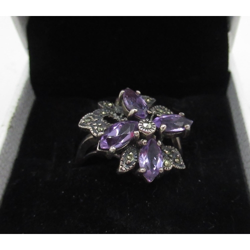 60 - Sterling silver ring with amethyst petals claw set amongst leaves with inset marcasites, size R stam... 