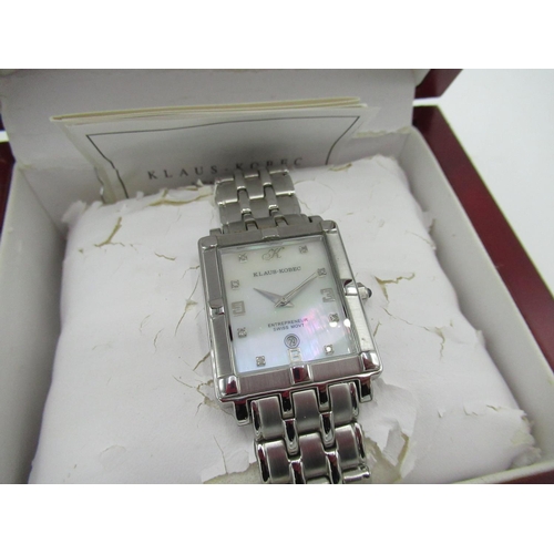 85 - Klaus-Kobec quartz wrist watch with date, mother of pearl dial, rectangular stainless steel case on ... 