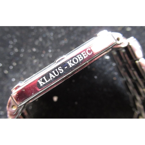 85 - Klaus-Kobec quartz wrist watch with date, mother of pearl dial, rectangular stainless steel case on ... 