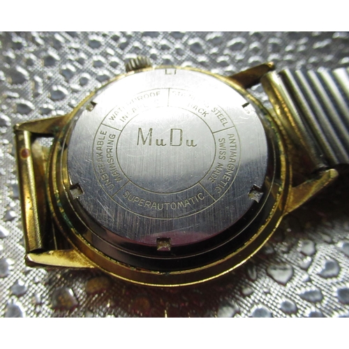 76 - Mudu Doublematic wristwatch with date, gold plated case on expanding bracelet, screw off stainless s... 