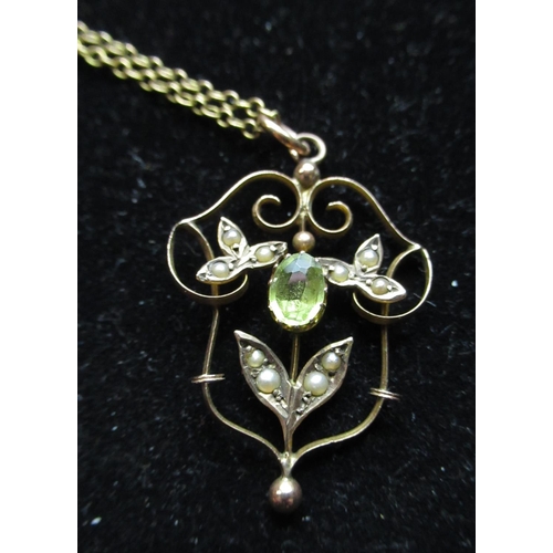35 - 9ct rose gold necklace with claw set oval Peridot mounted in an openwork pendant inset with seed pea... 