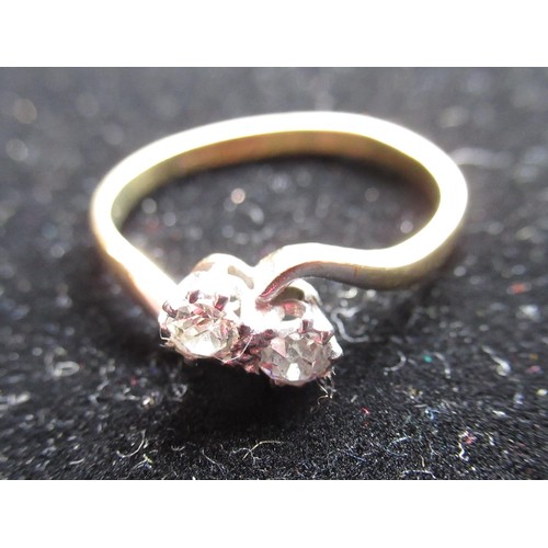 34 - 18ct yellow gold diamond ring with two round cut, claw set diamonds, stamped 18ct & Plat, size P 1/5... 