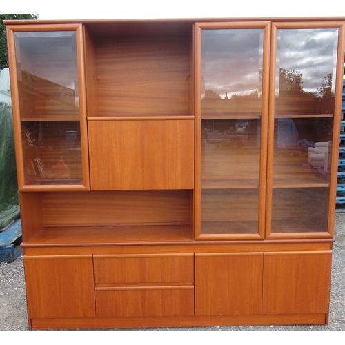 773 - Mid century teak side cabinet with three bevelled glazed doors and fall front above three doors and ... 