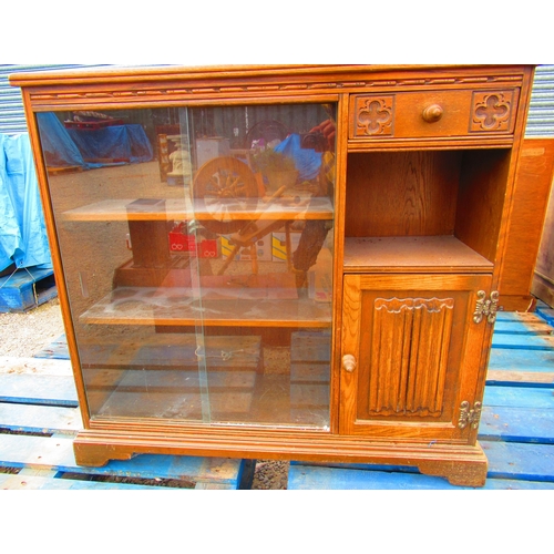 774 - Old Charm oak side cabinet with two glazed doors, linen fold panel door and Gothic drawer on plinth ... 