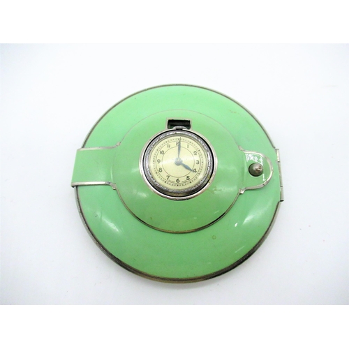 230 - Art Deco green enamel circular compact, hinged lid with with Swiss made clock