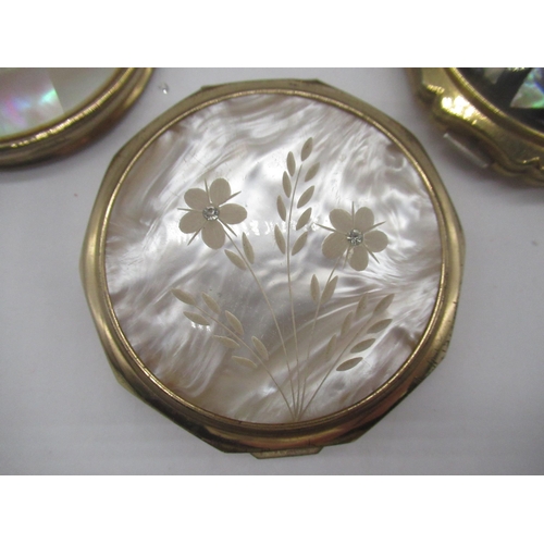 254 - Stratton compact with Star carved in mother of pearl cover, a Stratton compact with flowers etched i... 
