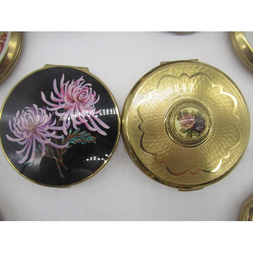 262 - Seven Stratton compacts with floral covers, a Melissa Compact with faux wood and floral cover and tw... 
