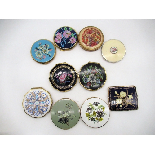 258 - Stratton compact with enamel and hand painted window to cover, eight Stratton compacts with floral c... 