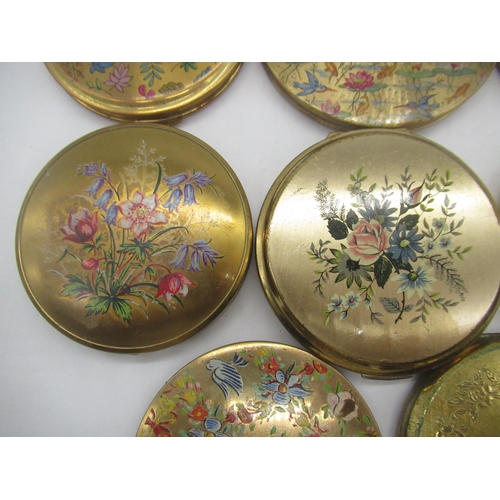 261 - Four Stratton compacts with floral prints on metal ground, Kigu compact with floral print on metal g... 