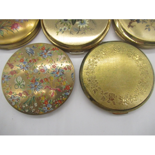 261 - Four Stratton compacts with floral prints on metal ground, Kigu compact with floral print on metal g... 