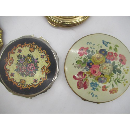 260 - Four Stratton compacts all with floral covers, three similar Kigu compacts, a Regent of London compa... 