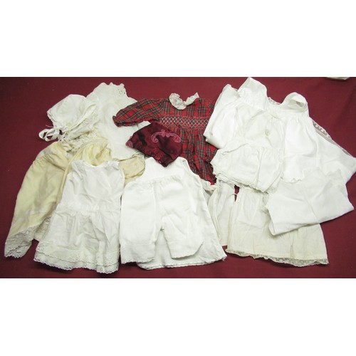 896 - Collection of Edwardian and later Doll and baby clothing in various colours and materials