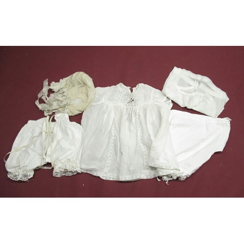 896 - Collection of Edwardian and later Doll and baby clothing in various colours and materials