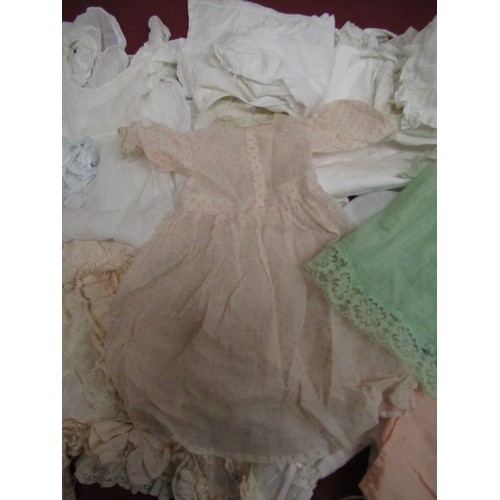 897 - Collection of Edwardian and later Doll and baby clothing in various colours and materials