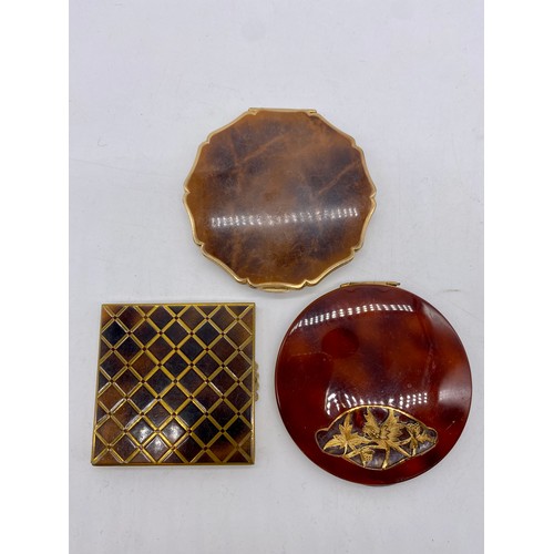 237 - Stratton tortoiseshell effect circular gilt compact Pat.764125, a similar square compact and another... 