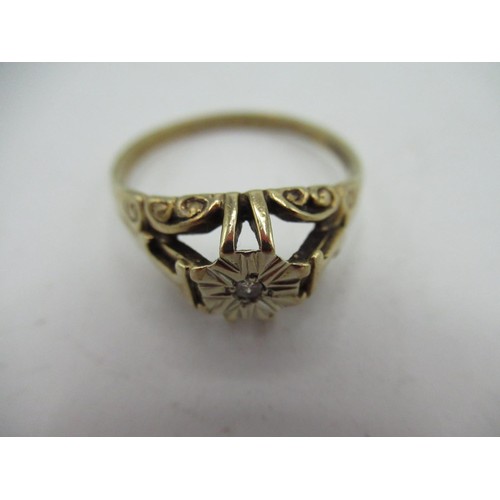 6 - 9ct yellow gold diamond ring, central round cut diamond inset in a white metal illusion mount, pierc... 