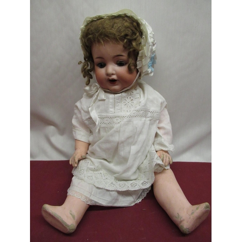 876 - Armand Marseille 996 A 7 M bisque headed doll with curly brown wig, satin bonnet and lace detailed n... 