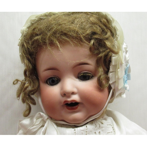 876 - Armand Marseille 996 A 7 M bisque headed doll with curly brown wig, satin bonnet and lace detailed n... 