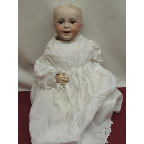 877 - SFBJ French bisque headed doll model 235 10, wearing lace detailed christening gown, H47cm