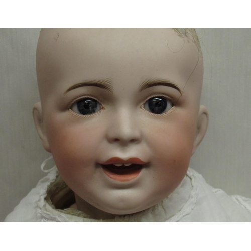 877 - SFBJ French bisque headed doll model 235 10, wearing lace detailed christening gown, H47cm