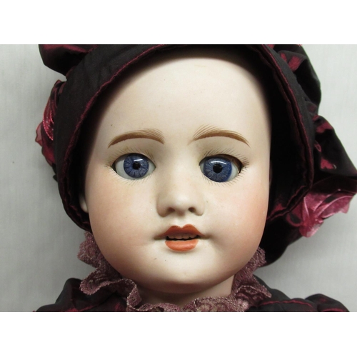 879 - SFBJ French bisque headed doll stamped 6 to the base of the neck, wearing crinoline bonnet and jacke... 