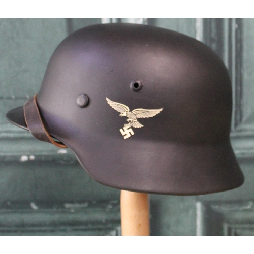101 - Quality reproduction Luftwaffe WWII helmet, with decal, complete with liner
