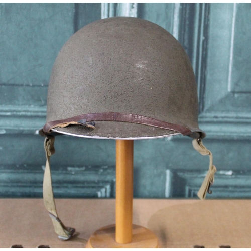 102 - WWI period American M1 steel helmet, complete with liner and webbing
