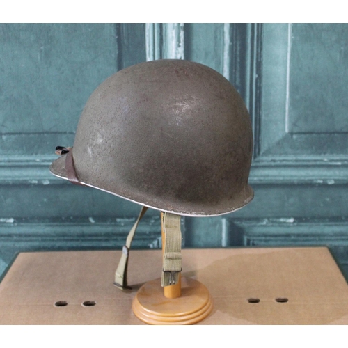 102 - WWI period American M1 steel helmet, complete with liner and webbing