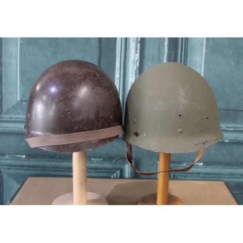 103 - Pair of WWII period M1 helmet liners, complete with webbing
