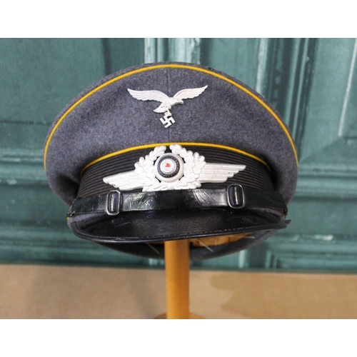 104 - WWII Luftwaffe NCO's peaked cap with makers name Geber. Alm, Berlin, 1938, size 57, and pair of offi... 