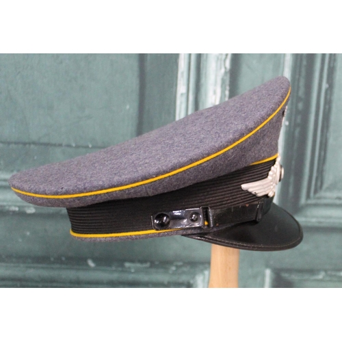 104 - WWII Luftwaffe NCO's peaked cap with makers name Geber. Alm, Berlin, 1938, size 57, and pair of offi... 