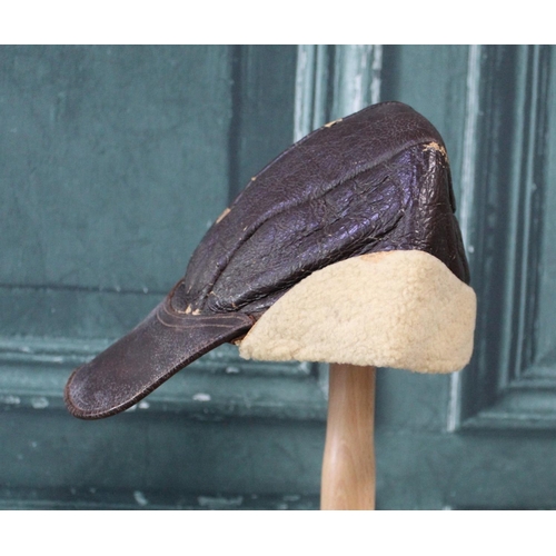 108 - WWII period USA sheepskin flying cap with leather peak