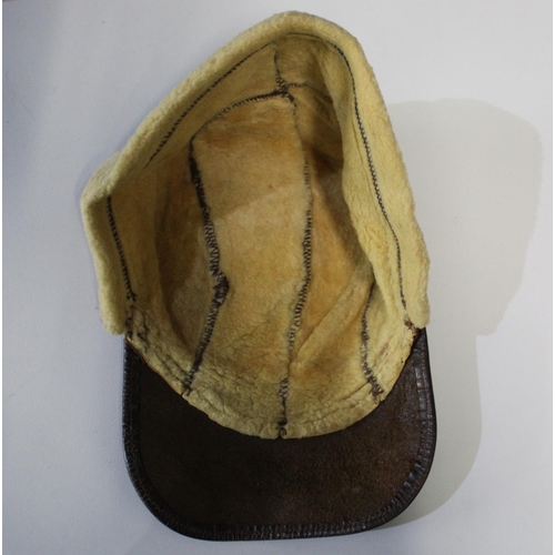 108 - WWII period USA sheepskin flying cap with leather peak